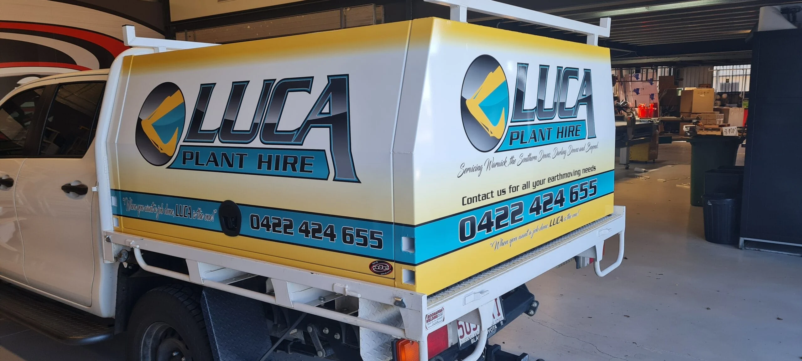 Luca Plant Hire ute canopy wrap with logo and phone number, in the ALE workshop