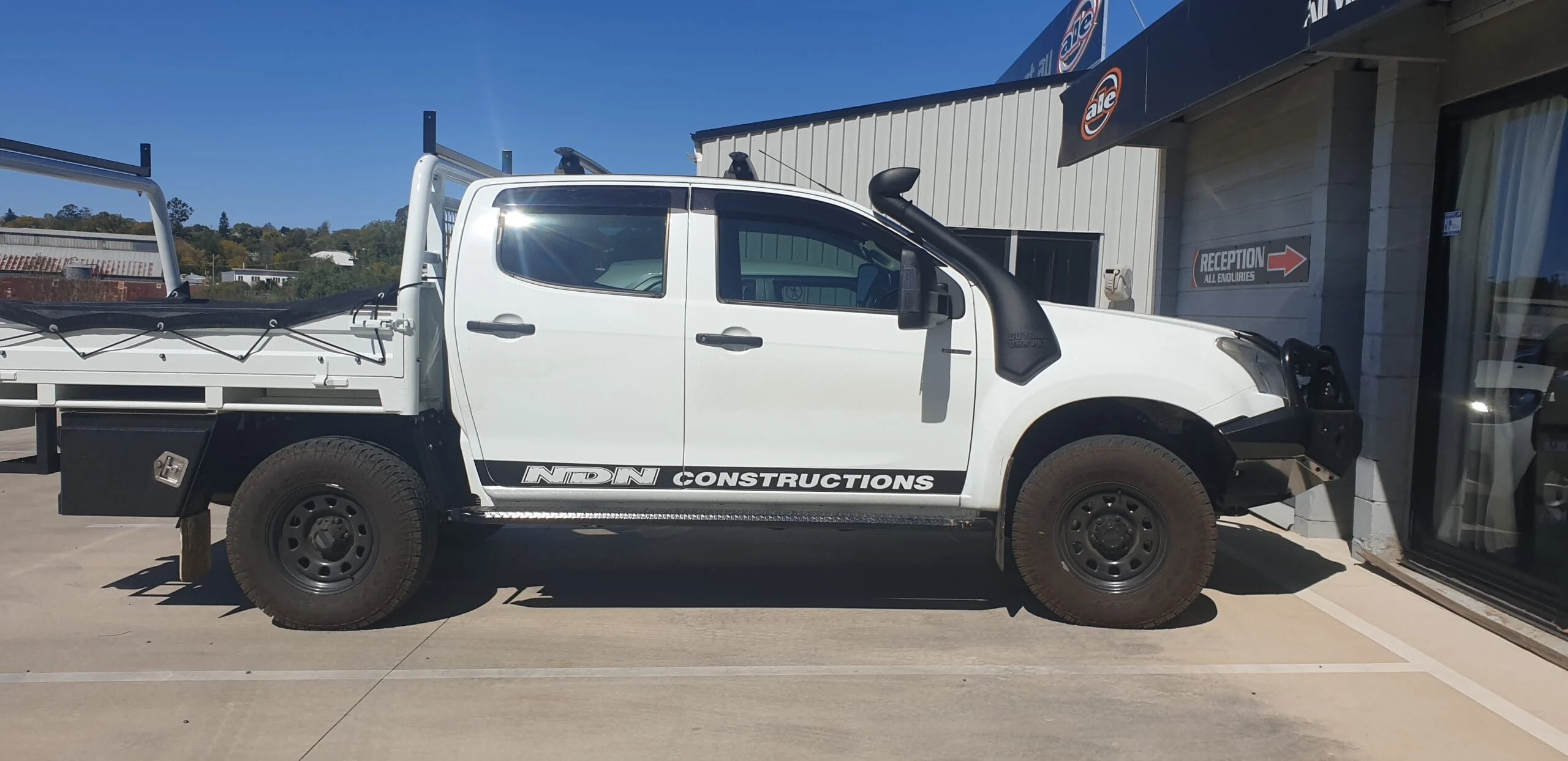 White ute with partial wrap graphics