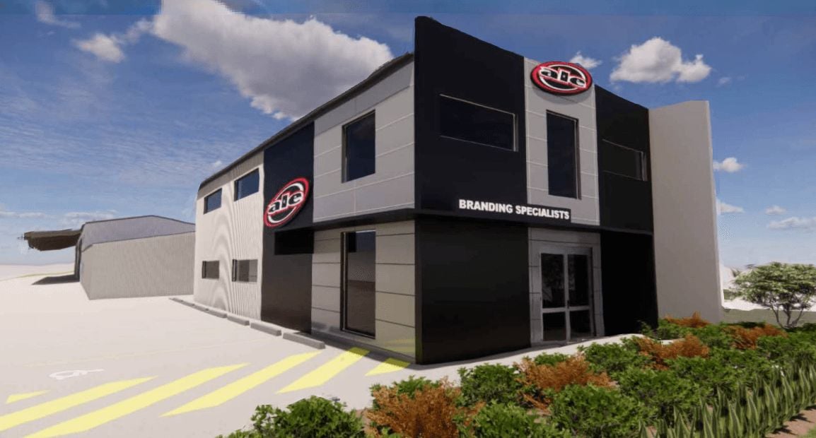 Render of the new ALE showroom building with Branding Specialists signage