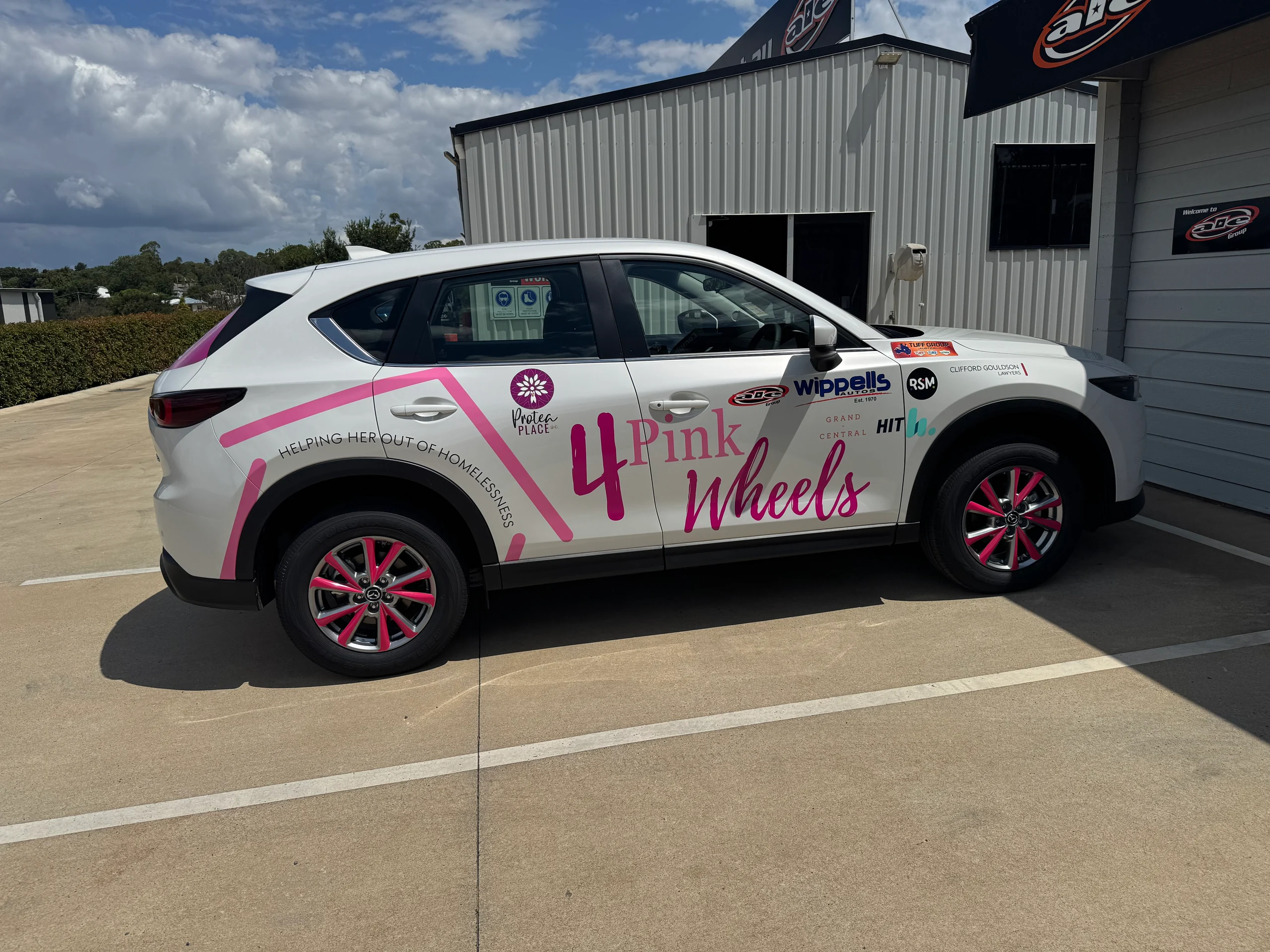 4 Pink Wheels wrapped SUV