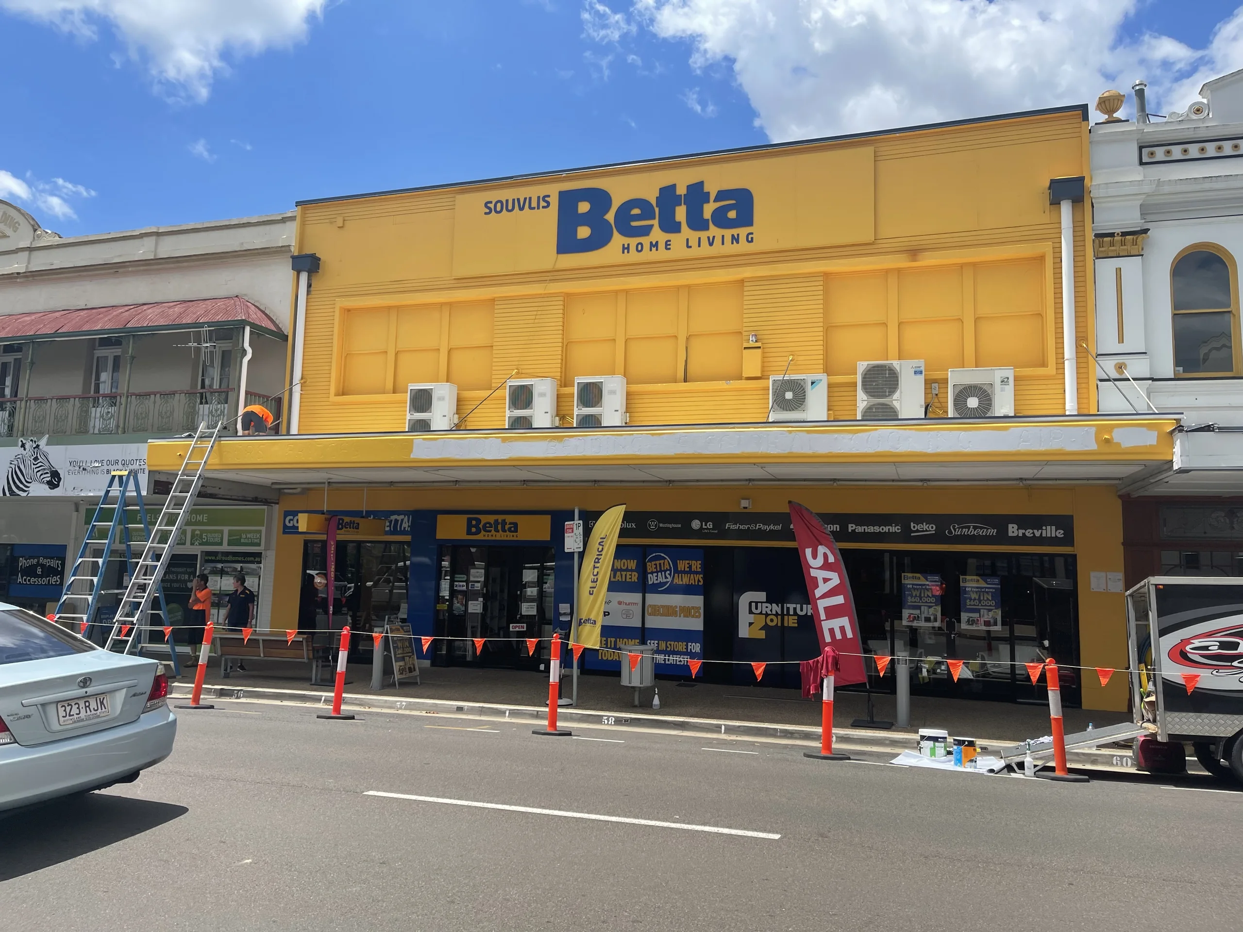 Betta Home Living store with the new yellow facade and Betta fascia over the street awning