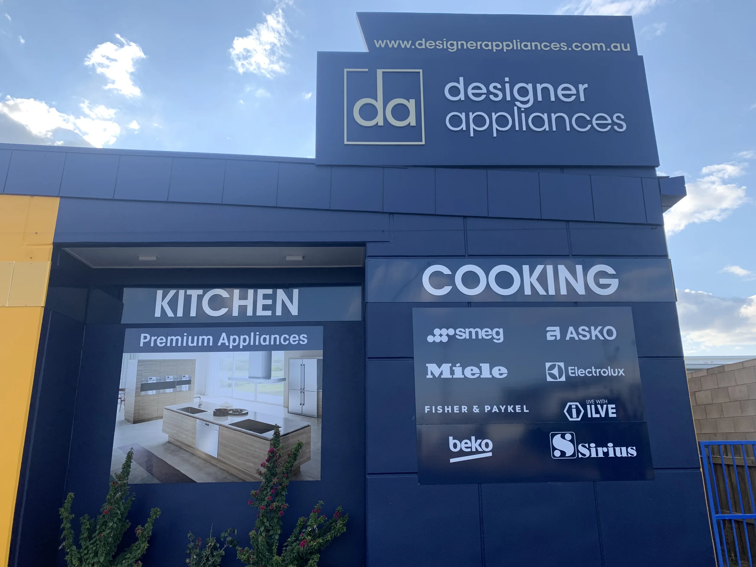 Designer Appliances building with Kitchen and Cooking signage panels