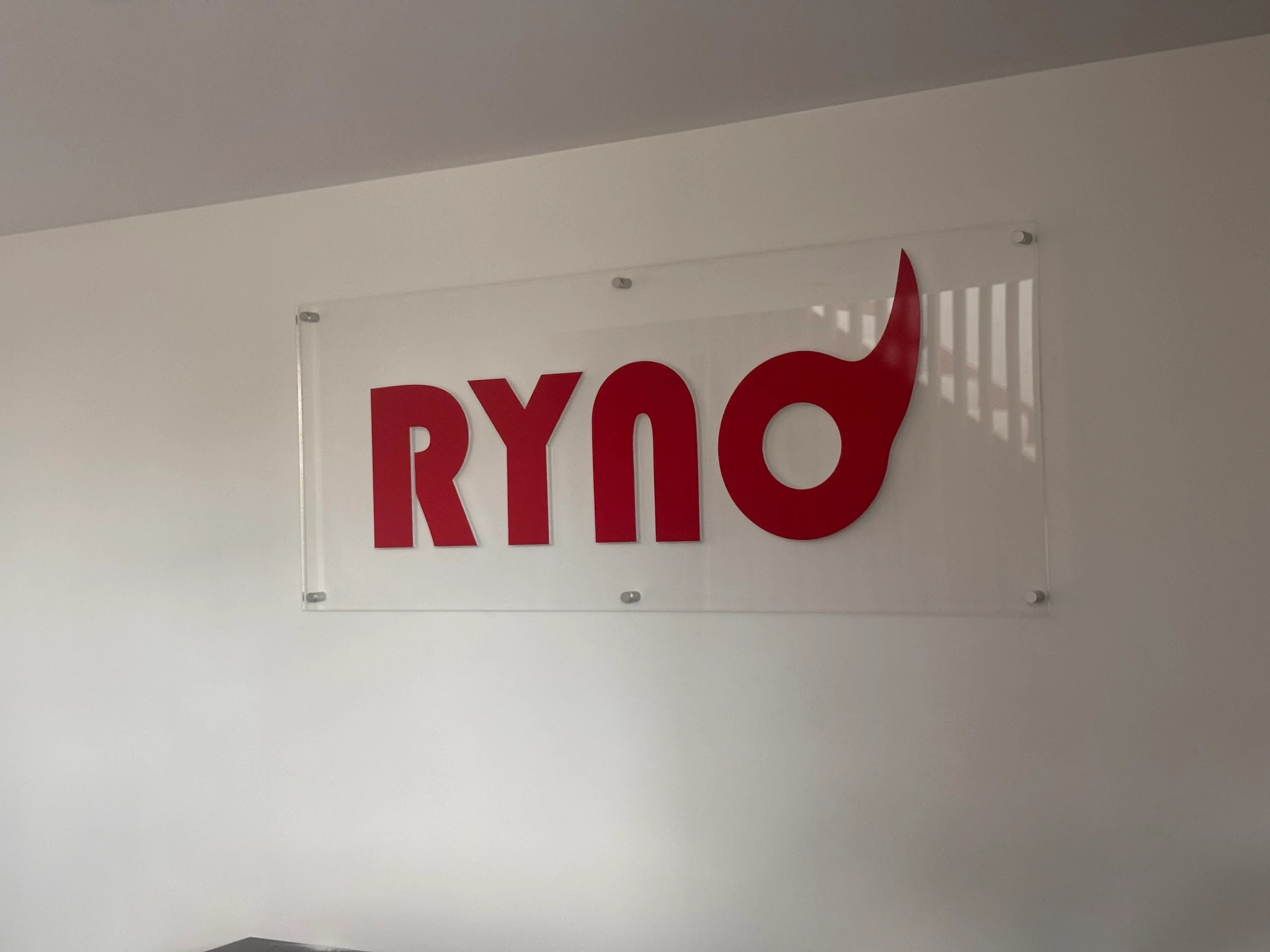 Acrylic Ryno logo on the reception wall