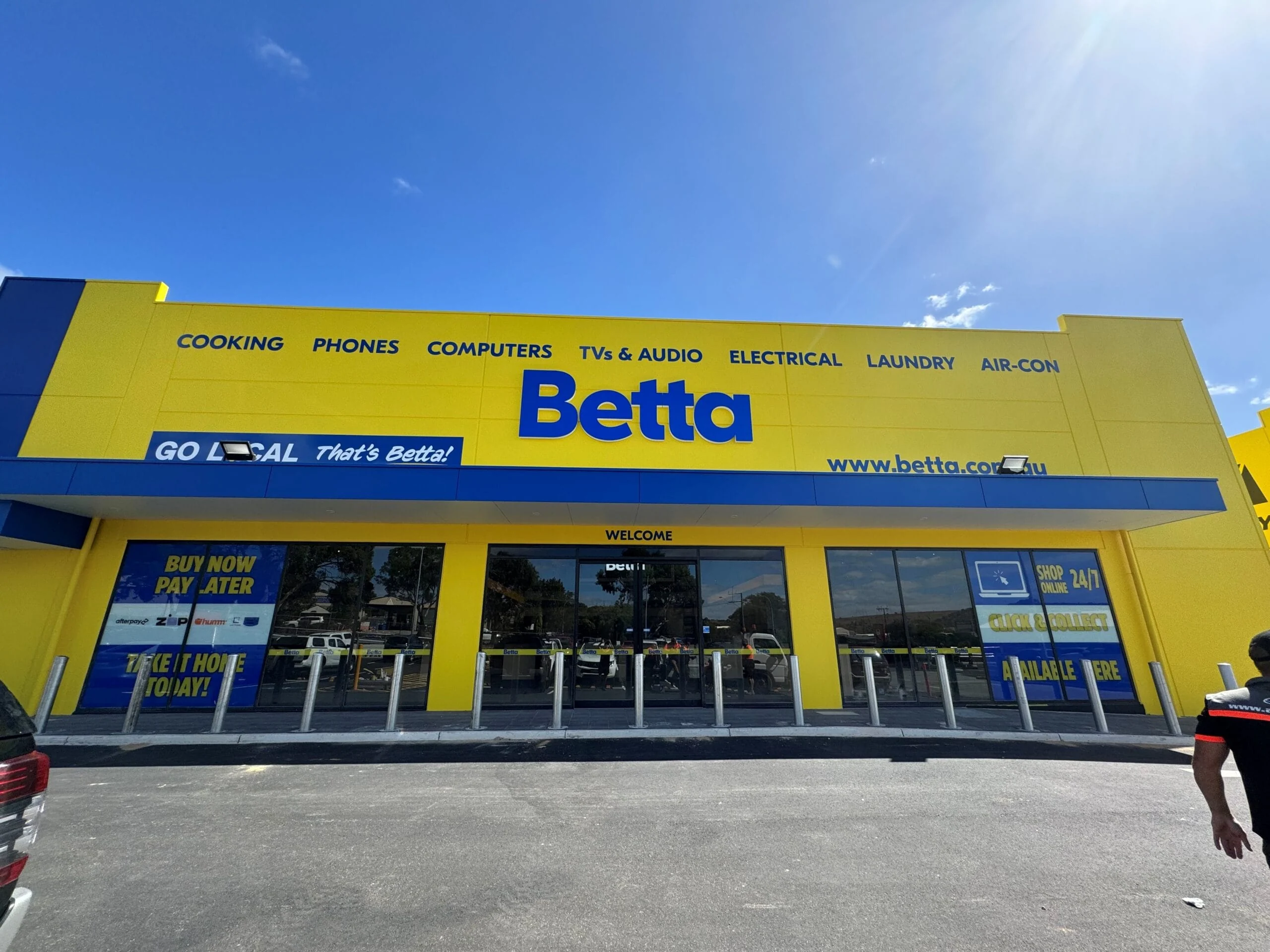 Betta shopfront signage in yellow and blue by ALE