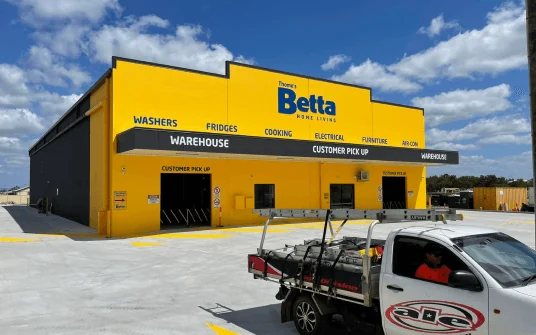Betta warehouse facade signage with an ALE ute parked out front