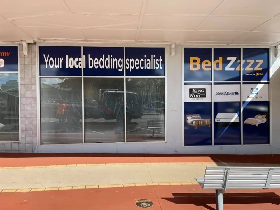 Bedding window graphics on a Furniture Zone store