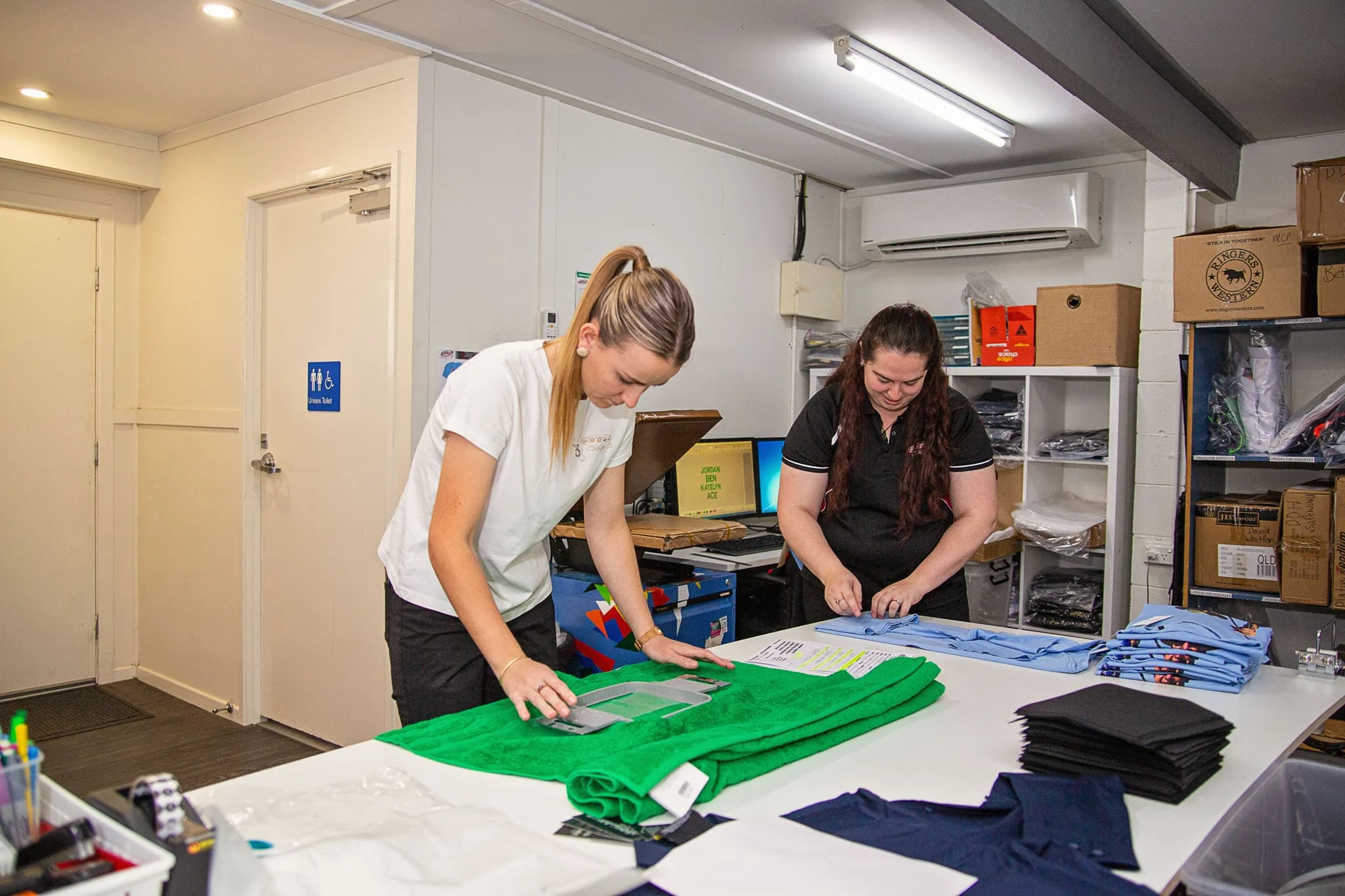 ALE staff packing uniform orders for dispatch
