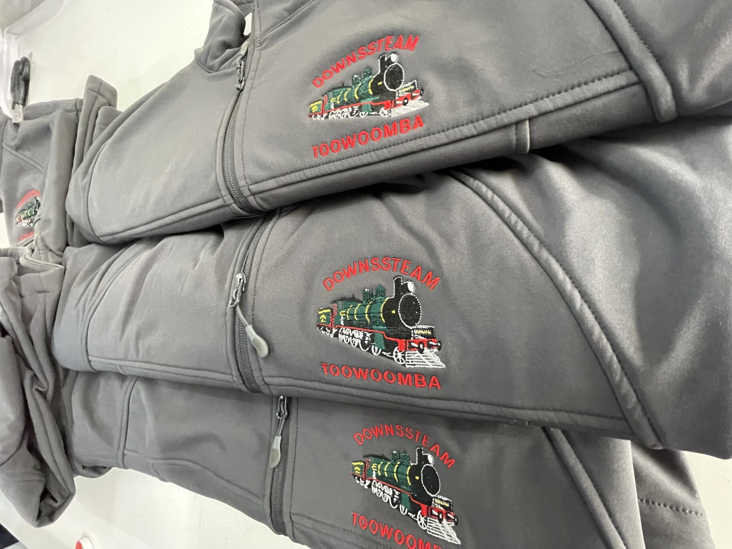Embroidered jackets with a train logo