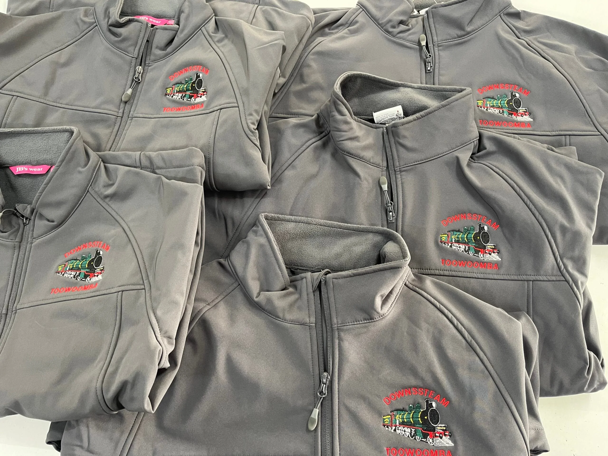 Embroidered jackets with a train logo