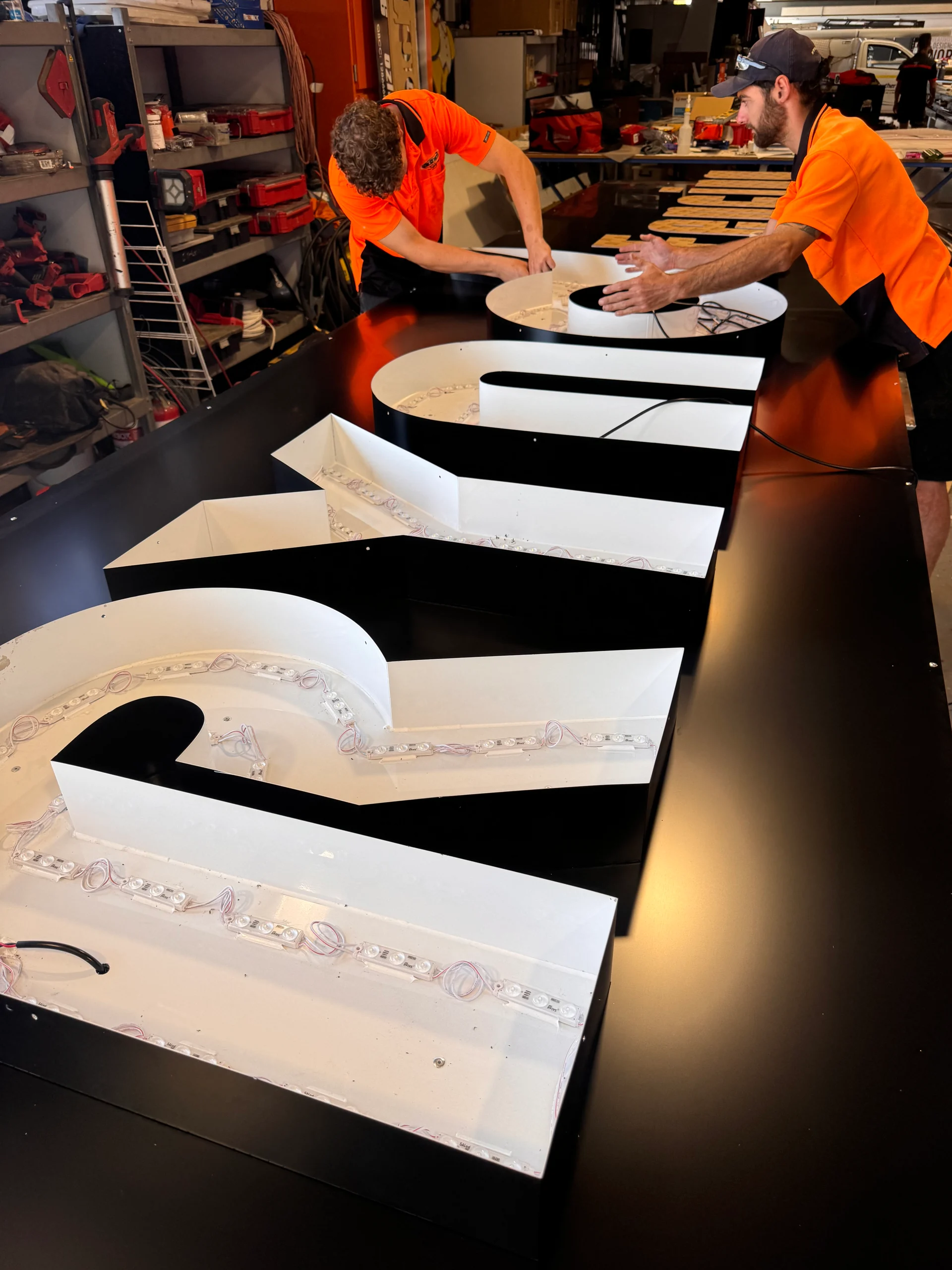 ALE fabricator finishing large 3D letters